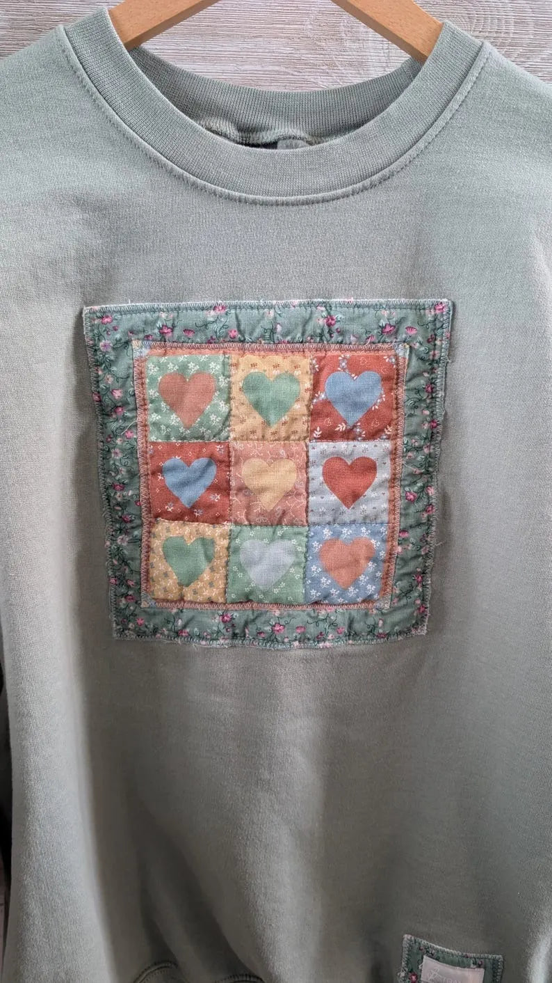 9 Patch Hearts Vintage Print on Sage Crewneck